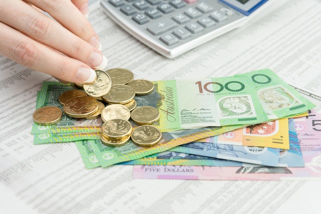 Australian money beside a calculator