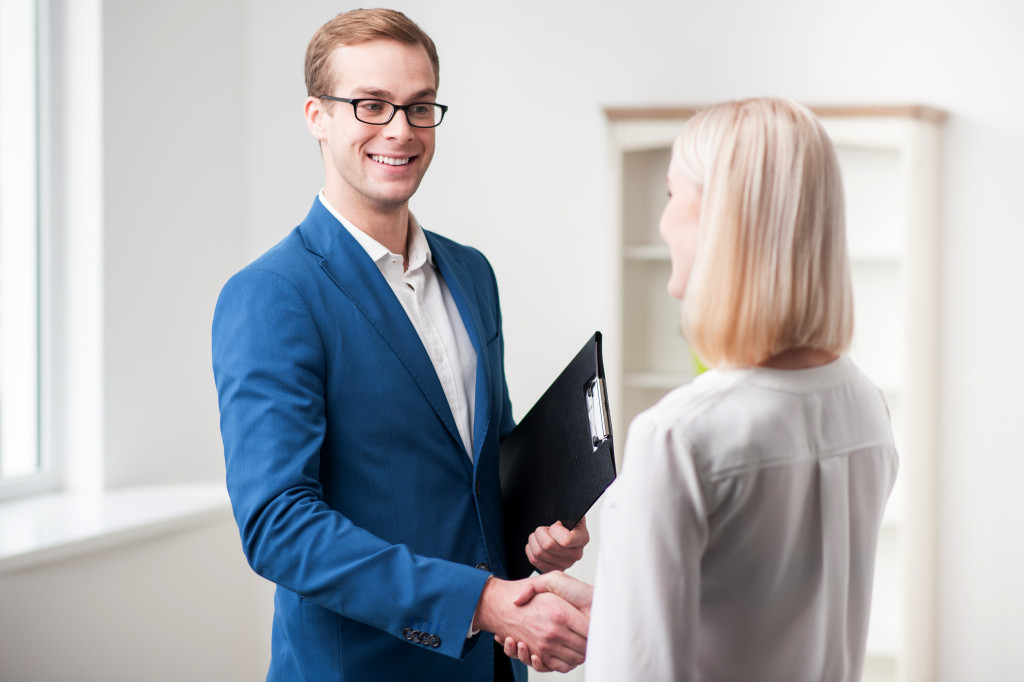 realtor shaking hands with a client
